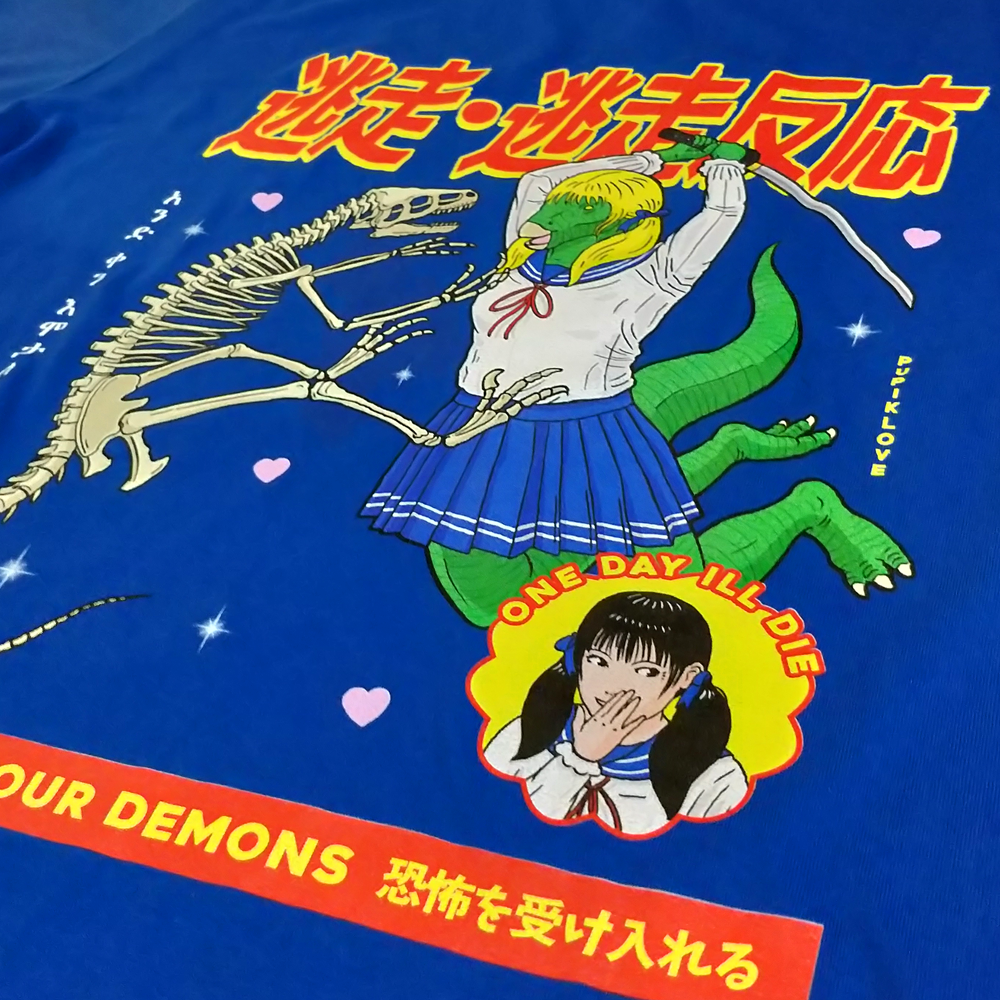 Close-up of the screen-printed front graphic on the royal blue shirt