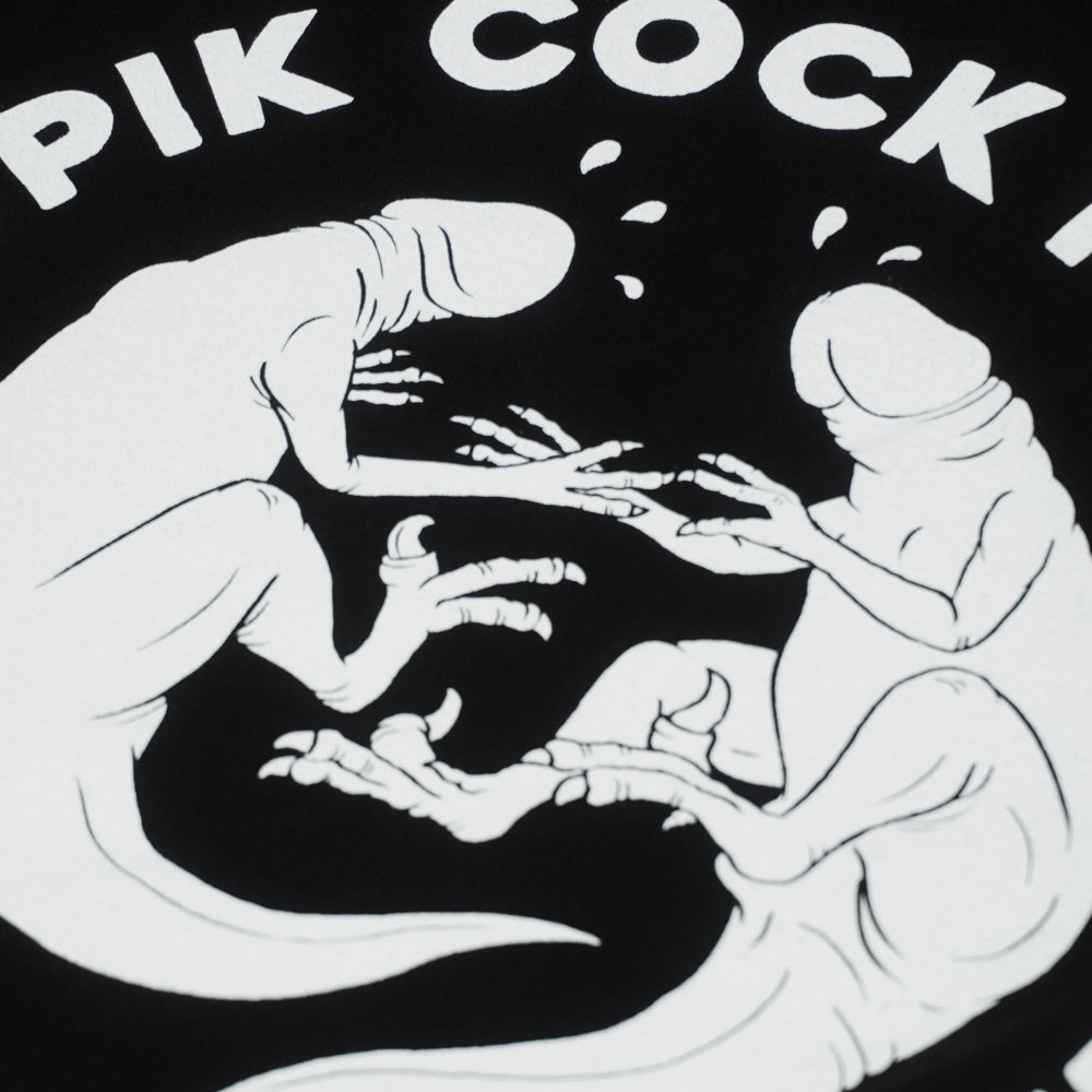 Close-up of the Pupik Cockfights front emblem showing two stylized creatures intertwined in a circular fight pose, printed with sharp lines