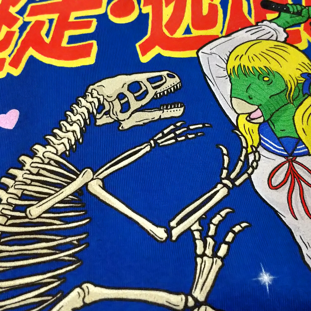 Close-up of the screen-printed front graphic on the royal blue shirt