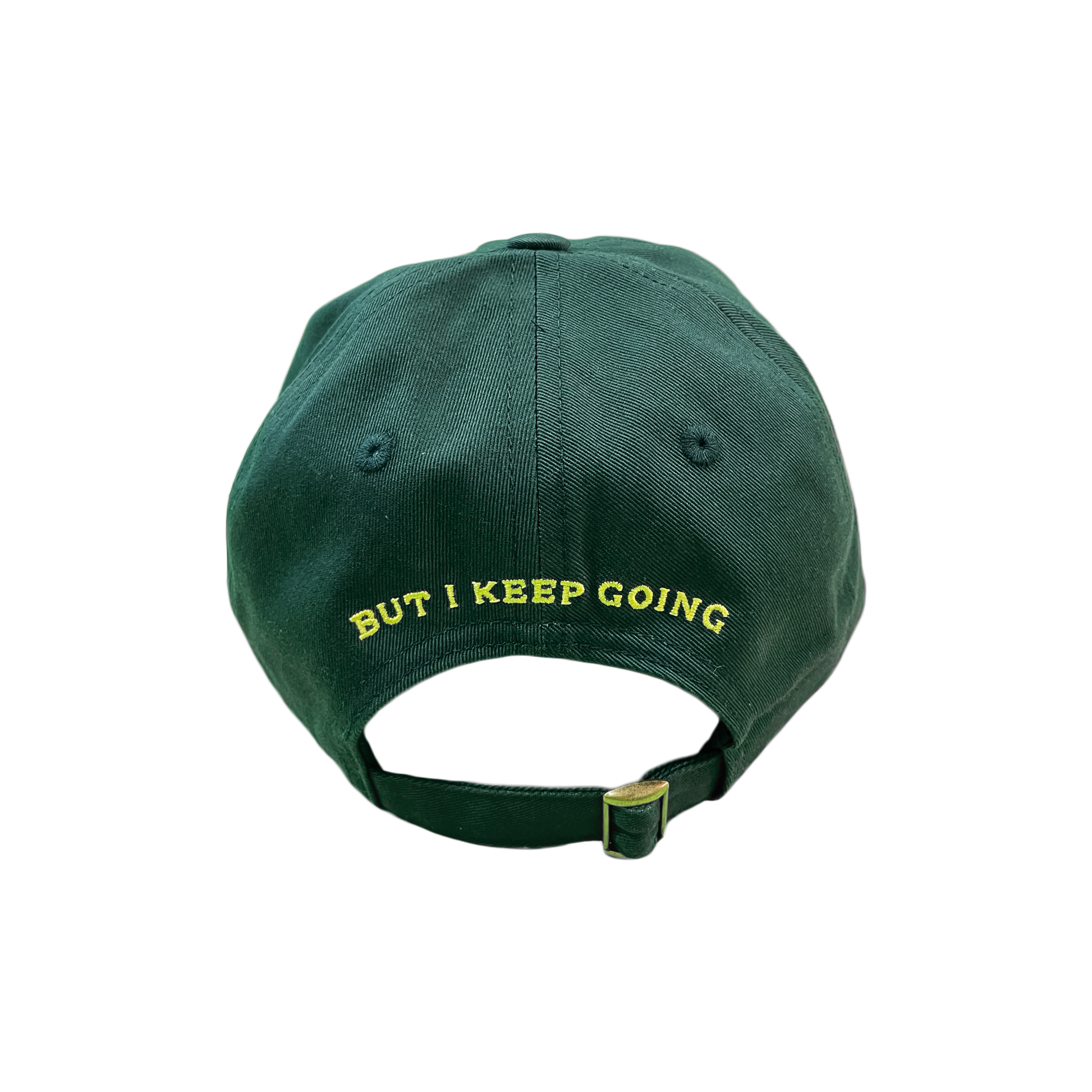 Green cap with 'BUT I KEEP GOING' text on a white background