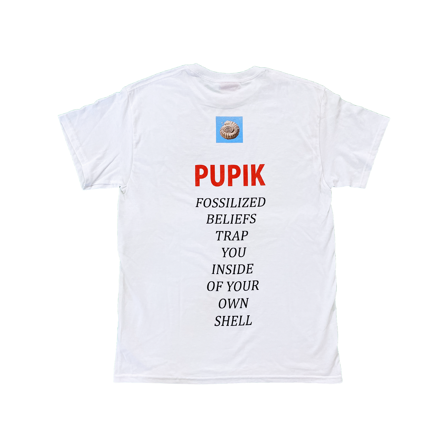 Back view of the Pupik white T-shirt featuring a small fossil graphic at the top, red Pupik text, and the phrase “Fossilized beliefs trap you inside of your own shell” printed vertically down the back.