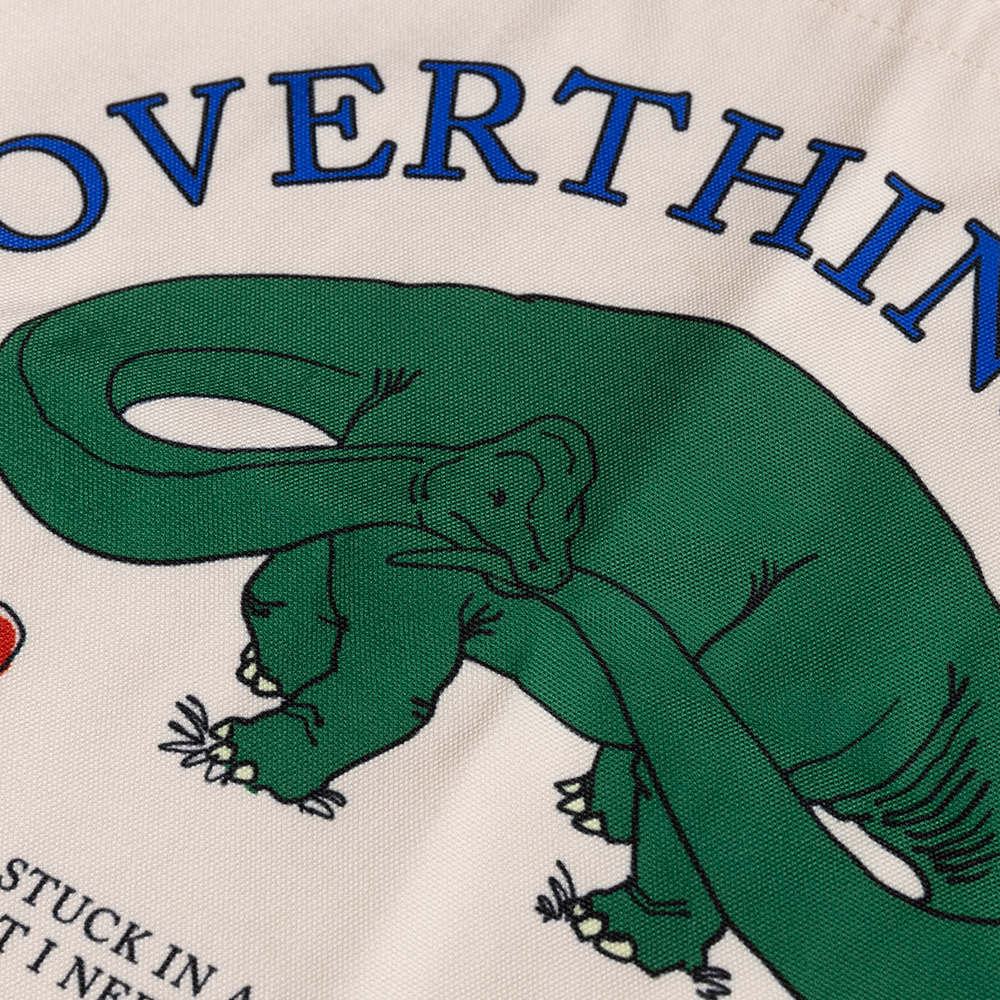 Green dinosaur illustration on a beige background with text