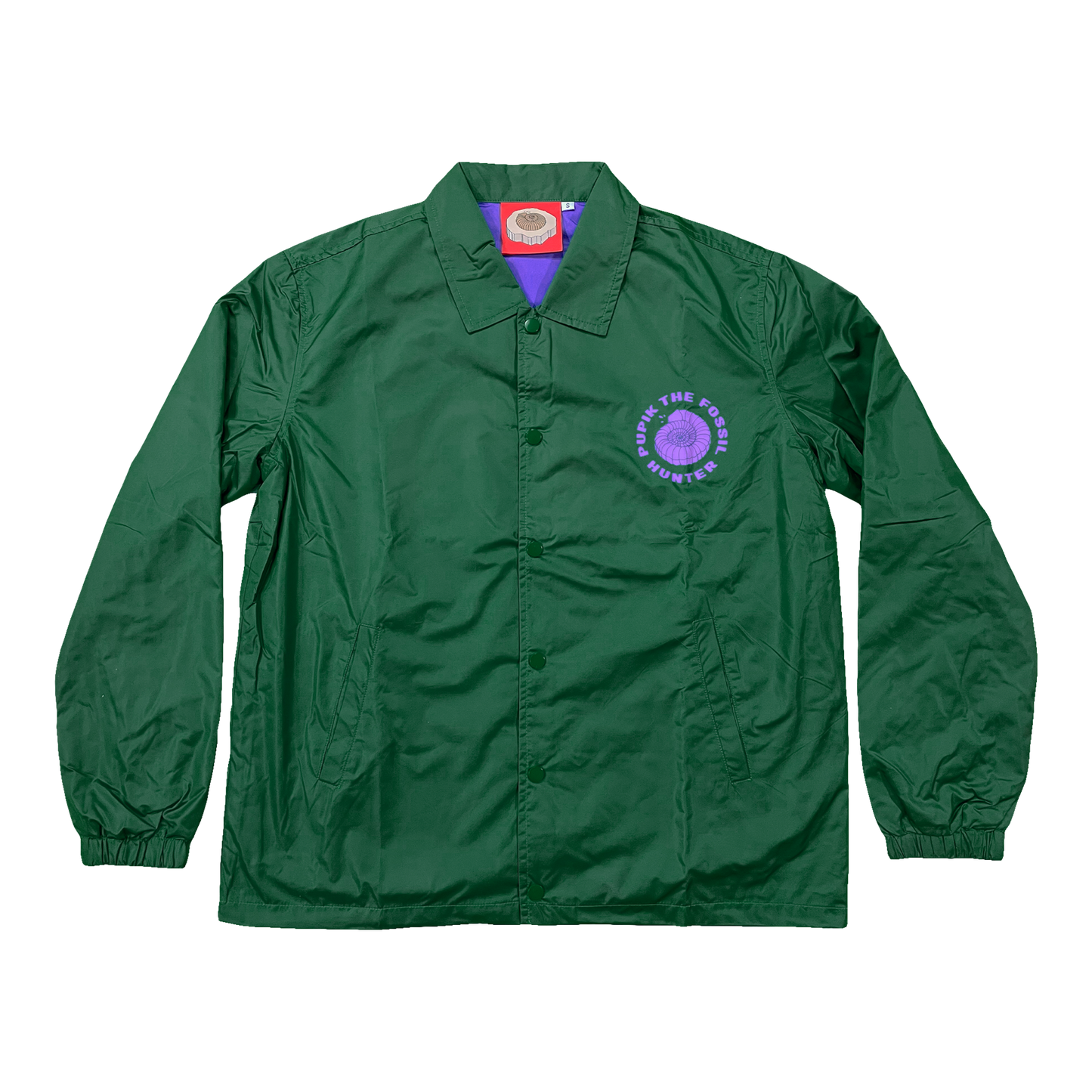 Pupik green windbreaker with a small purple Pupik graphic printed on the left chest.